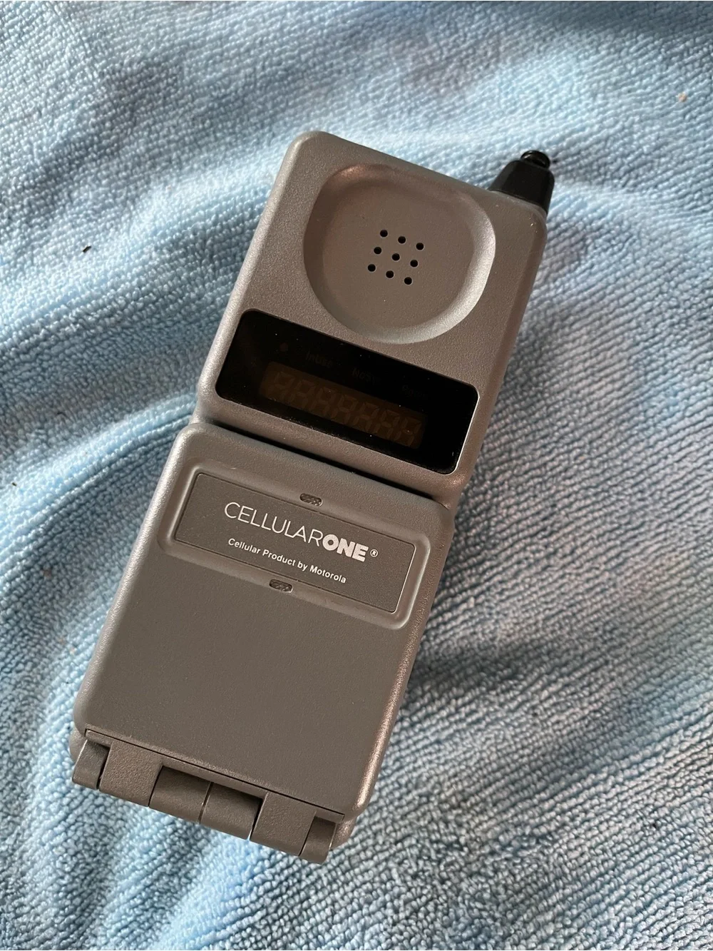Motorola Silver Flip Phone with Numeric Keypad and Antenna
